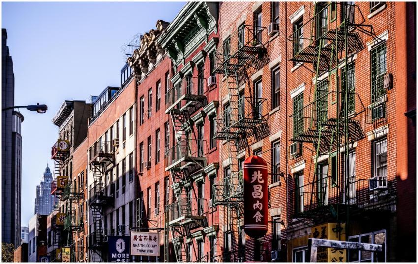 Colorful fire escape lined buildings in New York C