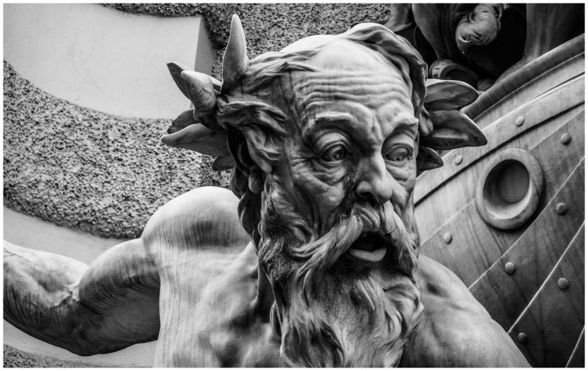 Black and white close-up of a dramatic stone sculp