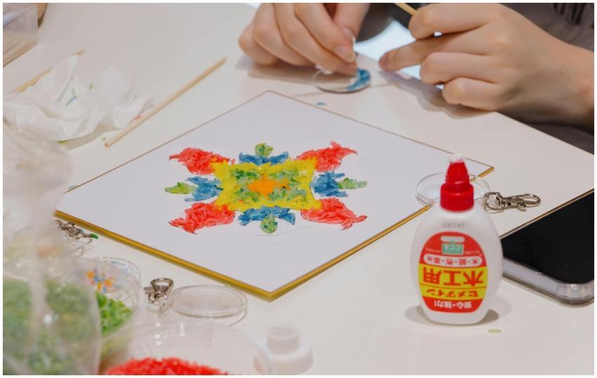 Colorful mosaic art creation using glue and beads