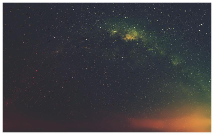 A breathtaking view of the starry night sky featur