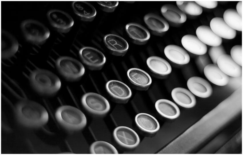 Close-up shot of vintage typewriter keys in black