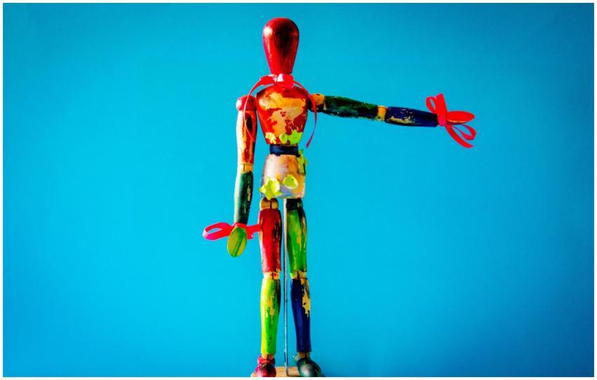 Vibrant wooden mannequin with artistic paint again