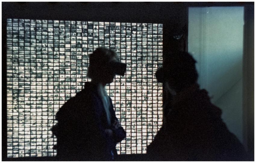 Silhouettes of people wearing VR headsets in front