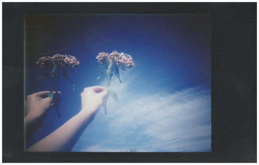 Creative double exposure featuring hands holding f