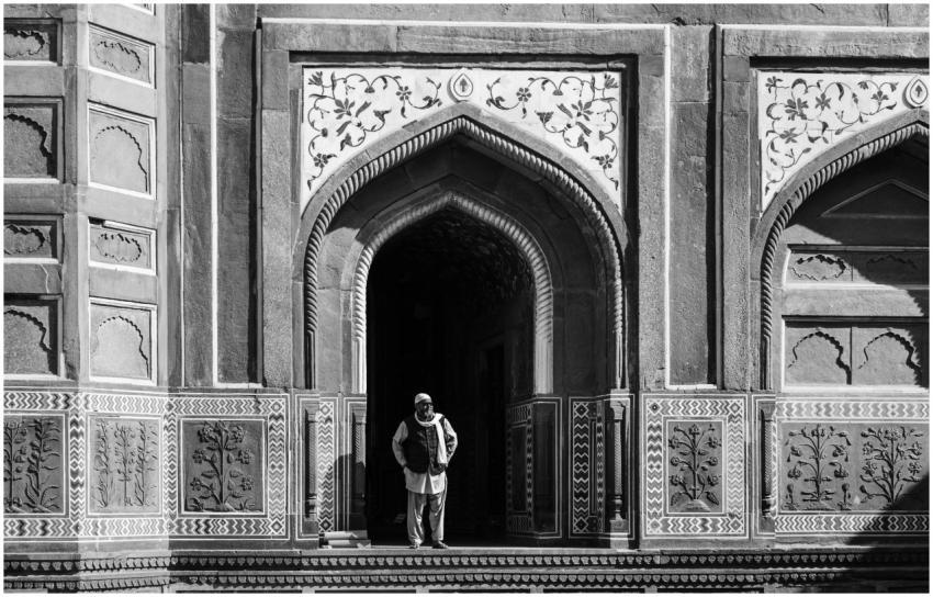 Black and white photo of a man standing in an Isla
