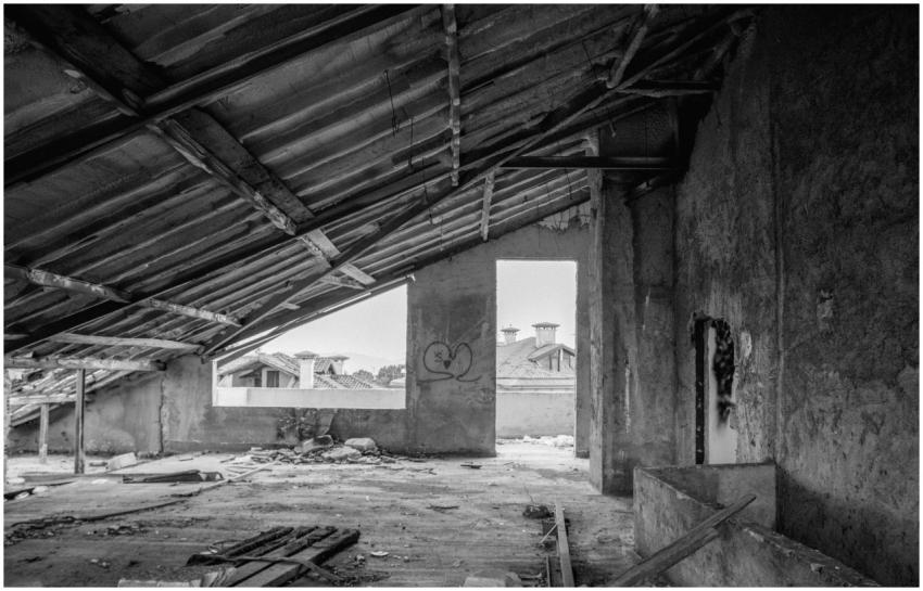 Black and white photo of an abandoned building's i
