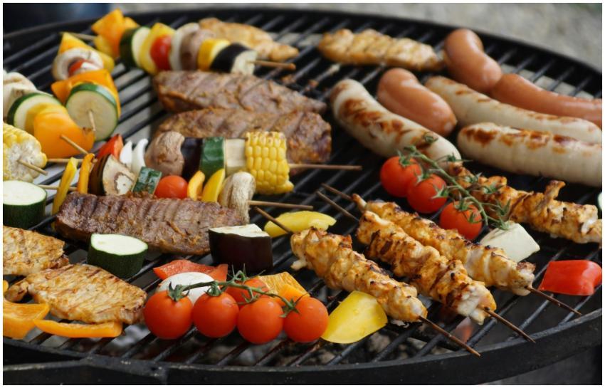 A vibrant assortment of grilled meats, sausages, a