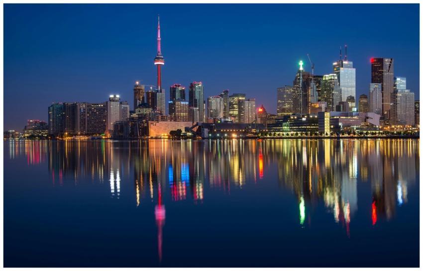 Stunning night view of Toronto skyline reflecting