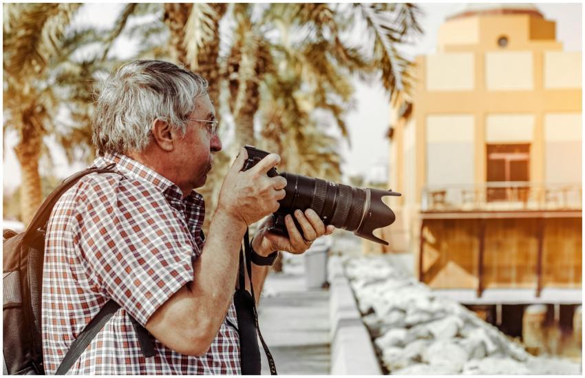 Senior photographer with DSLR in Dubai capturing i