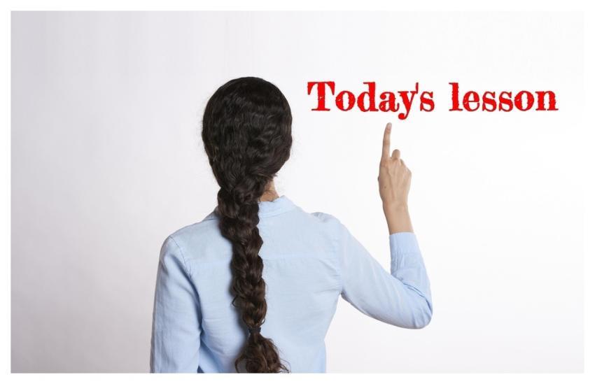 Teacher Back Showing Lesson