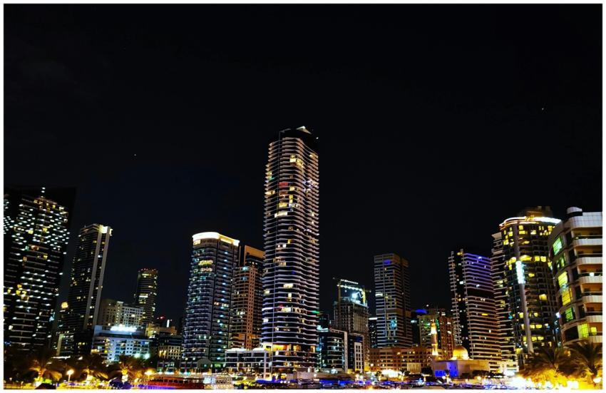 Stunning night view of the Dubai Marina skyline wi