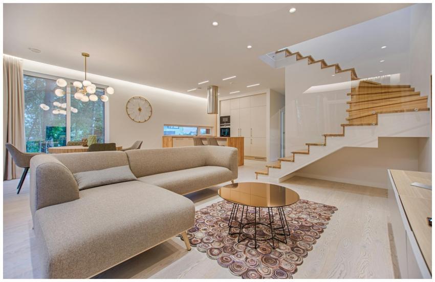 Contemporary living room with neutral tones, a sle