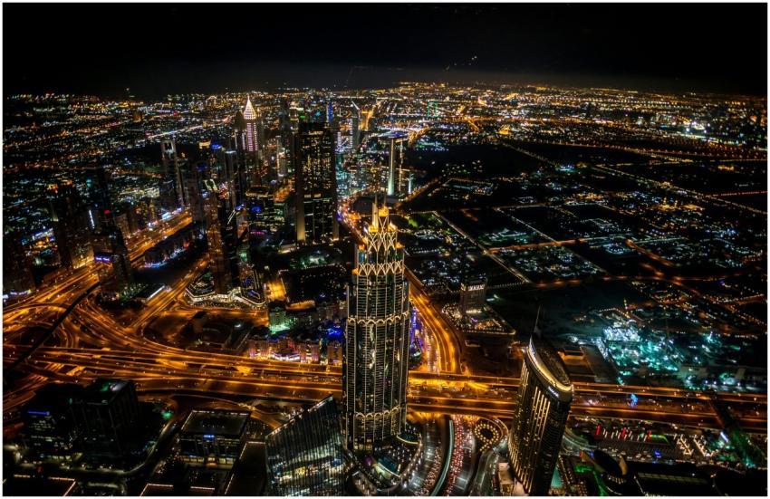 High-angle view of illuminated Dubai skyline at ni