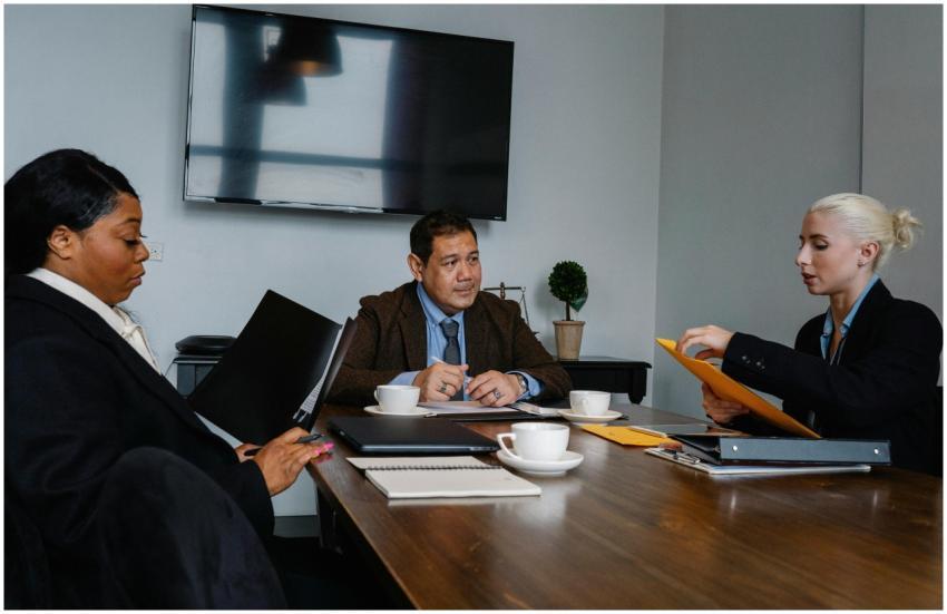 Group of multiethnic coworkers in formal wear sitt