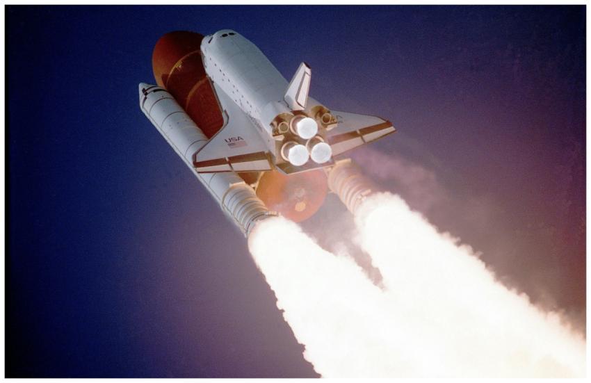 A space shuttle launches into space, showcasing po