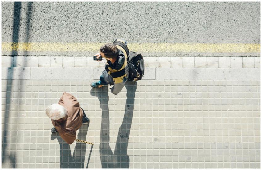 Top view of people walking on a sunny street in Ba