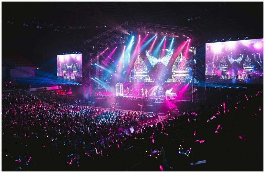 Colorful live concert with vibrant lighting, energ