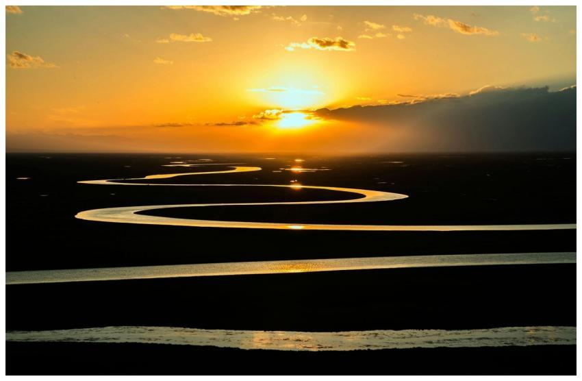 Capture of a meandering river at sunset, highlight