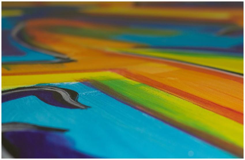 Close-up of a colorful abstract painting featuring