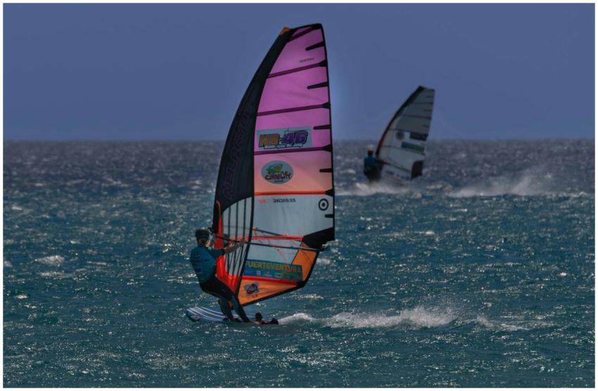 Two windsurfers enjoy the vibrant waters of Fuerte