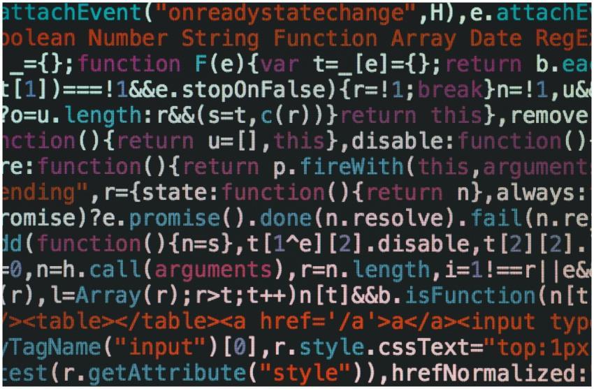 Close-up of colorful coding text on a dark compute
