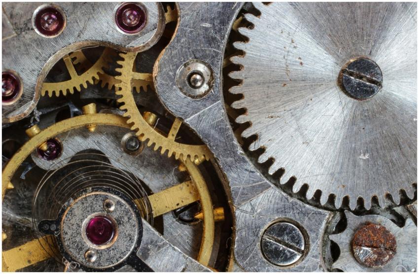 Detailed close-up of interlocking gears and cogs i