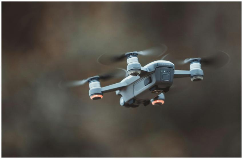 A detailed close-up of a drone flying in an outdoo