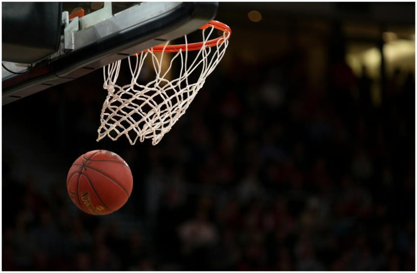 A basketball going through the hoop during a fast-