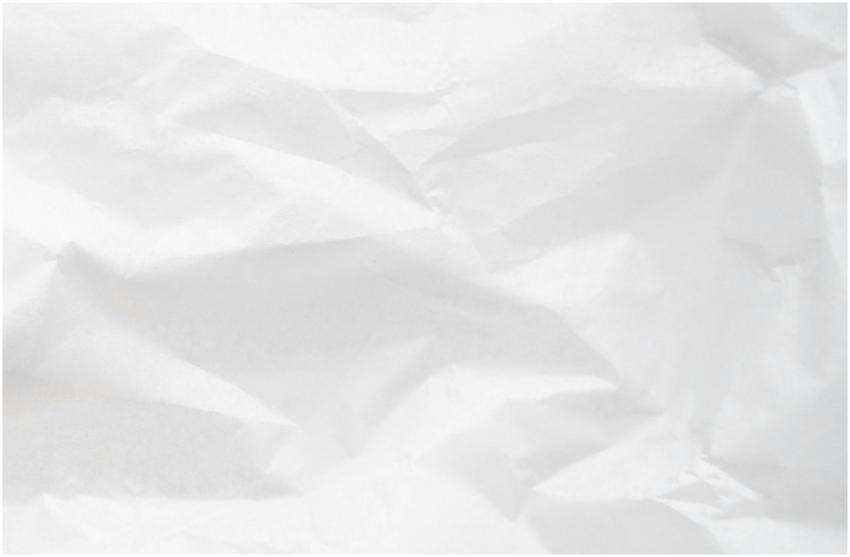 A detailed texture of crumpled white paper with vi