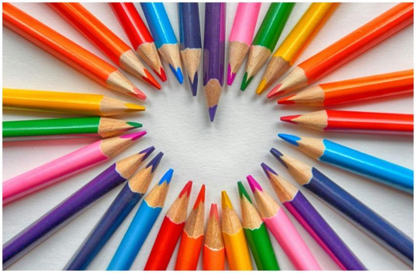 Vibrant colored pencils creatively arranged in a h