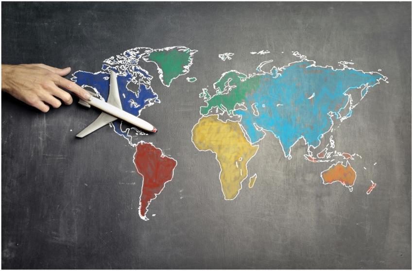 Top view of crop anonymous person holding toy airp