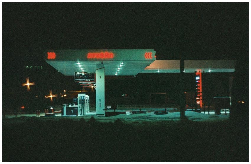 Atmospheric night view of an illuminated gas stati