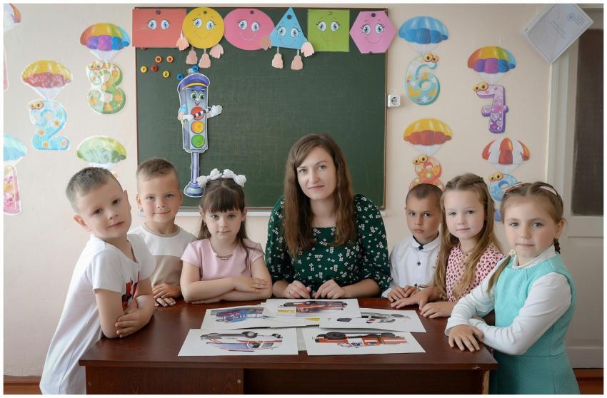 A group of children with their teacher in a vividl