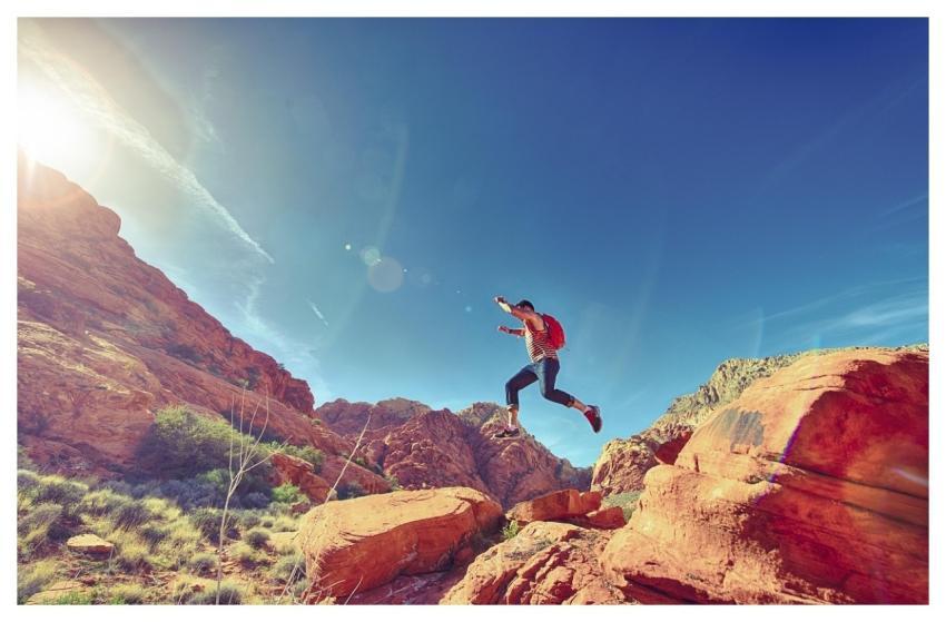 Man Jumping Mountains Rock Formations