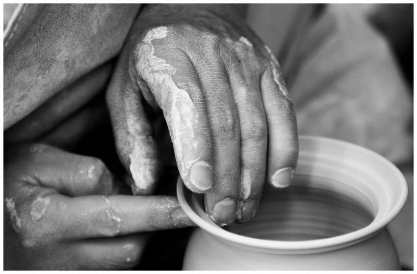 Artistic black and white close-up of hands shaping