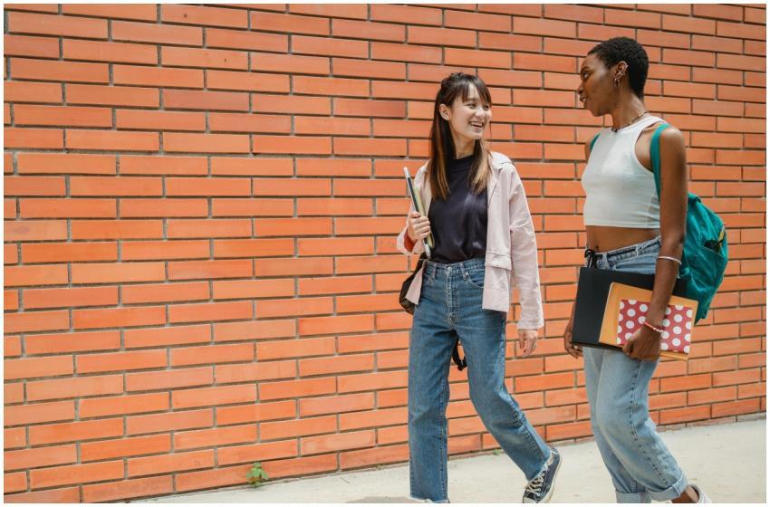 Positive African American female student with note