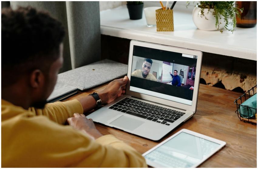 A man participates in an online video conference c