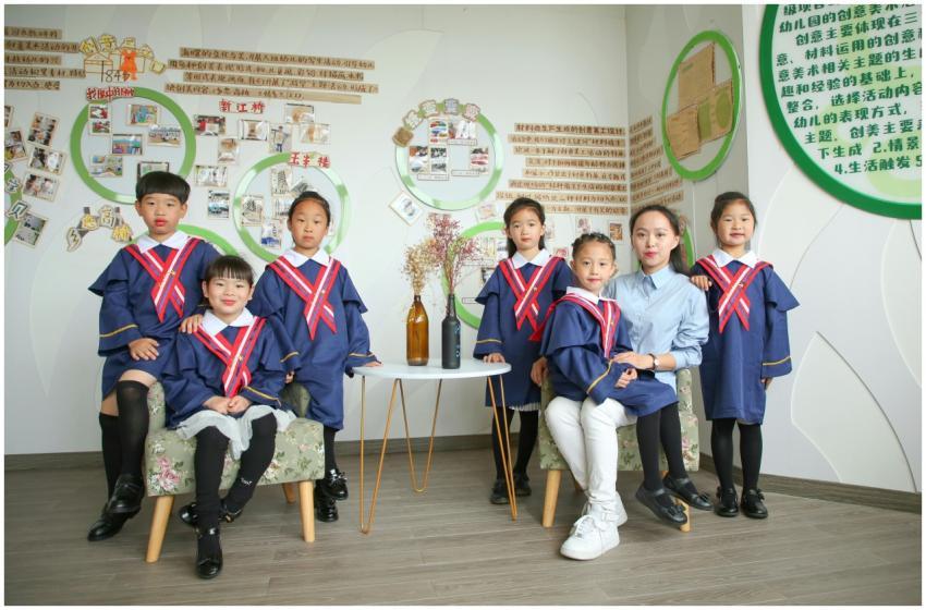 Children in uniforms with teacher in educational s