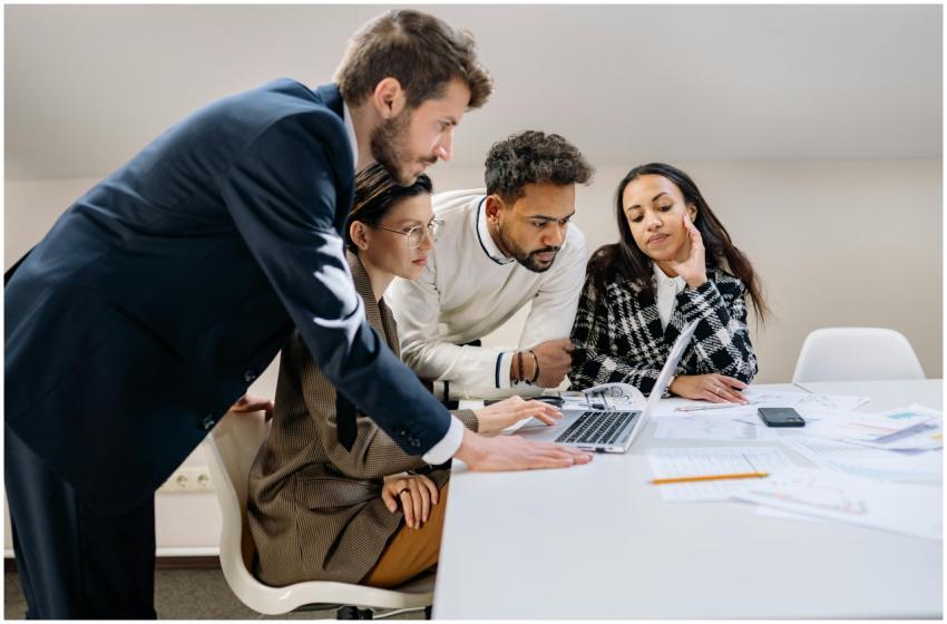 Focused group of colleagues working together on a