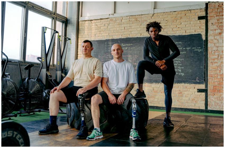 Diverse group of men with prosthetic legs posing c