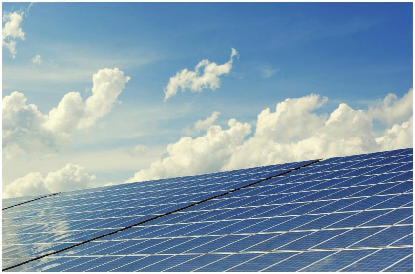 Sleek modern solar panels under a vibrant blue sky