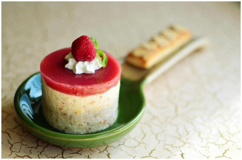 Elegant raspberry mousse cake with cream topping o