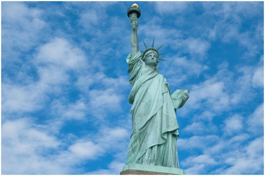 The iconic Statue of Liberty with a clear blue sky