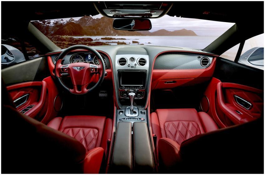 Red leather luxury sports car interior with mounta