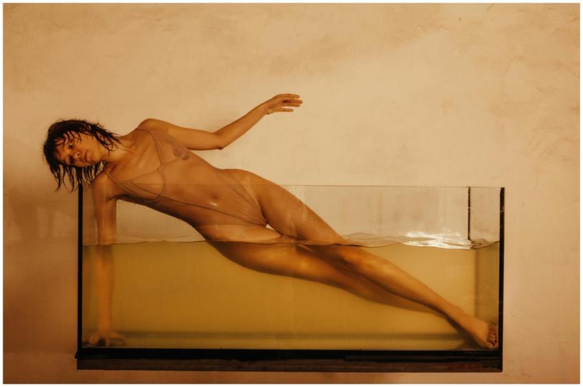 An evocative photograph of a woman posing in a wat