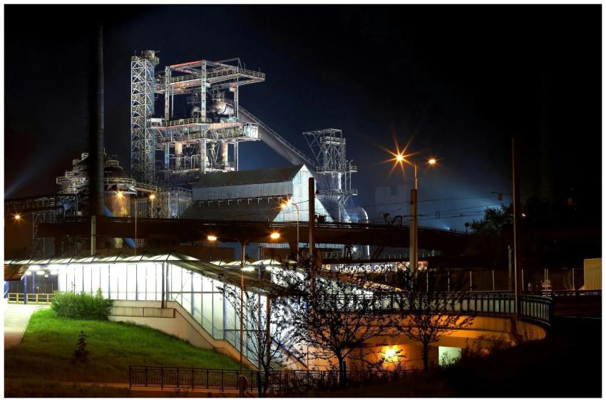 A beautifully illuminated industrial plant with st