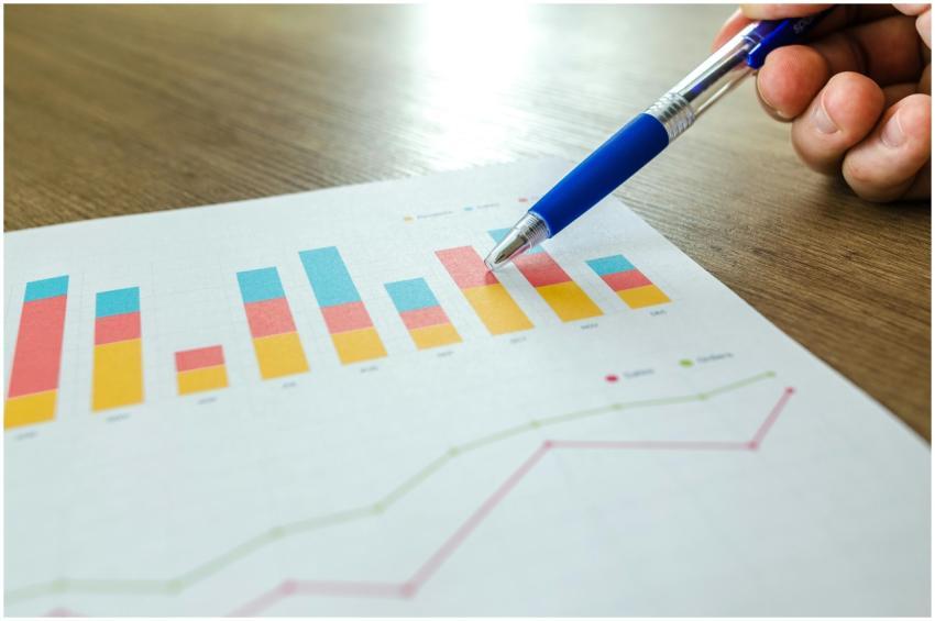 Detailed close-up of a hand pointing at colorful c