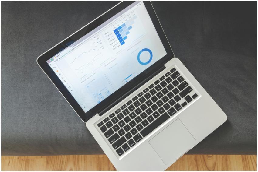 Overhead view of a laptop showing data visualizati