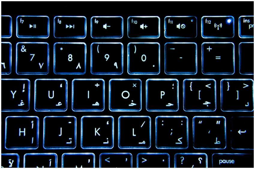 Detailed view of a backlit keyboard with Arabic nu