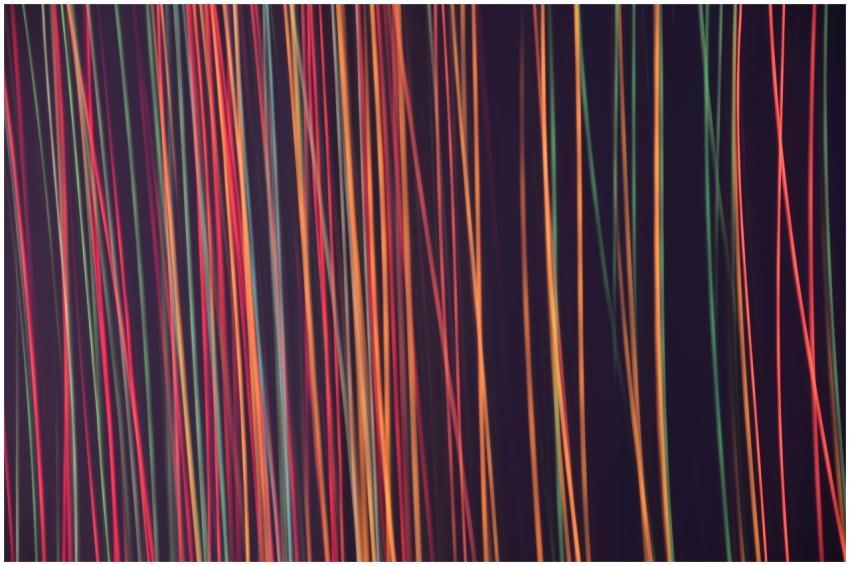 Colorful abstract lines on a dark background creat